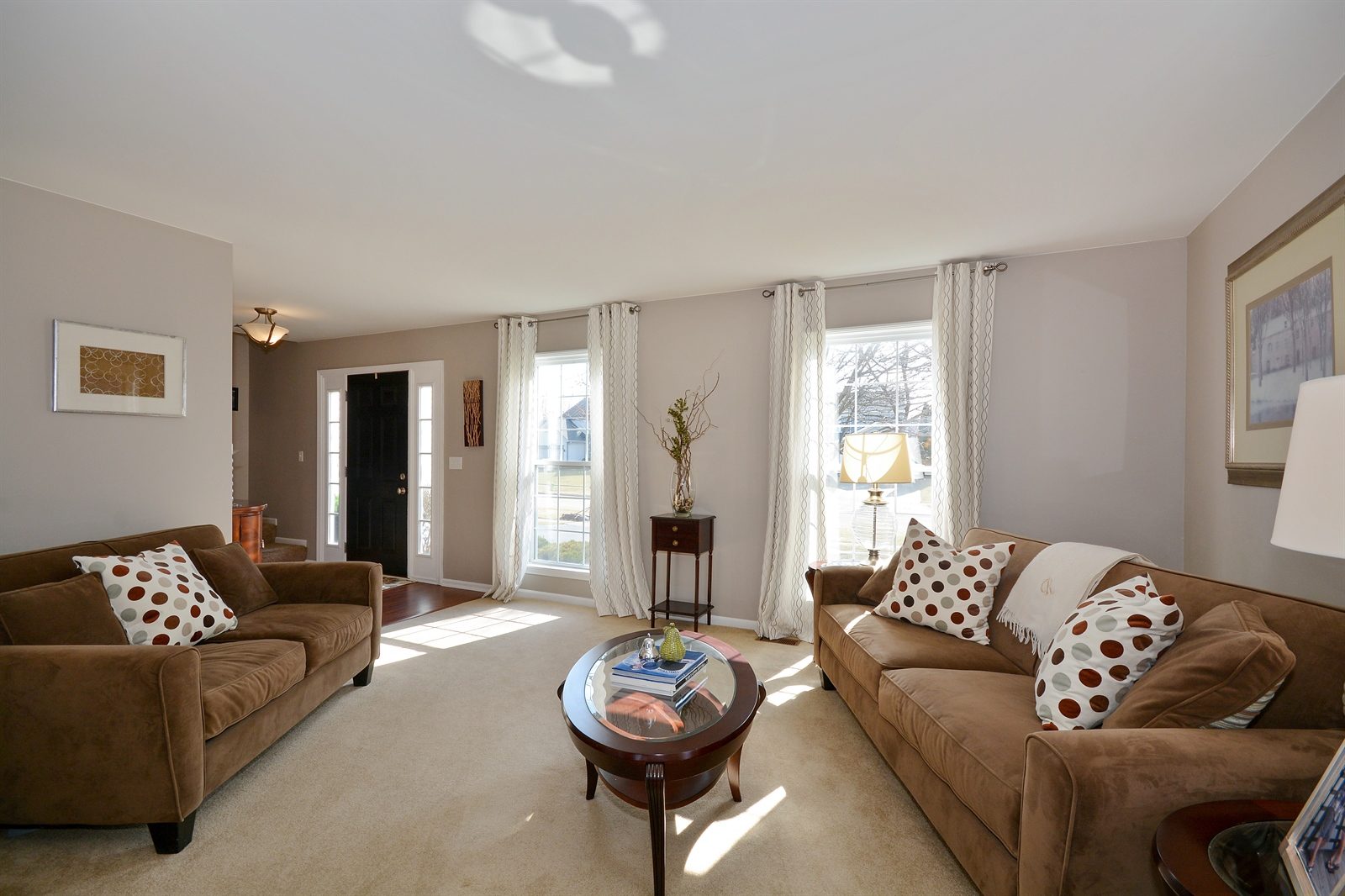 Installation of curtain rods for floor-to-ceiling curtains in living room