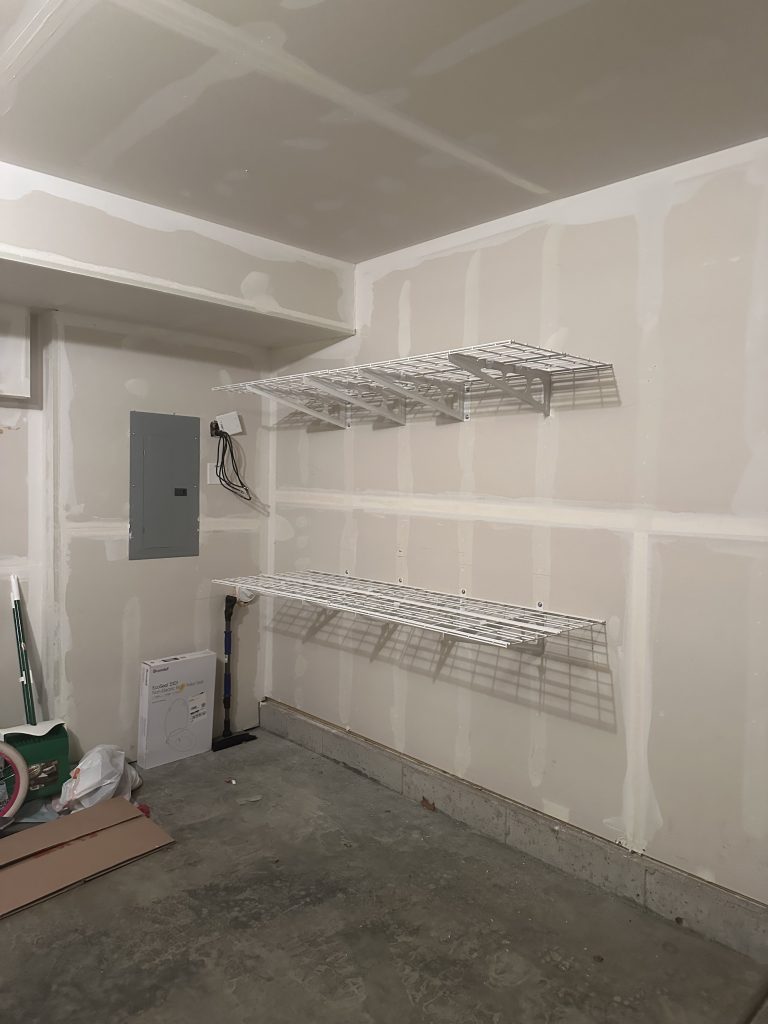 Installation of FLEXIMOUNTS wall shelving in garage