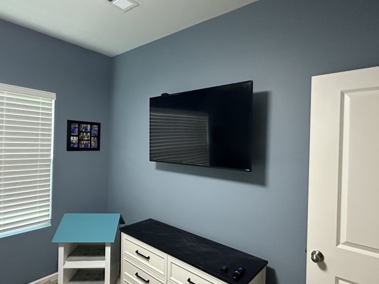 TV mounting and in-wall cord installation