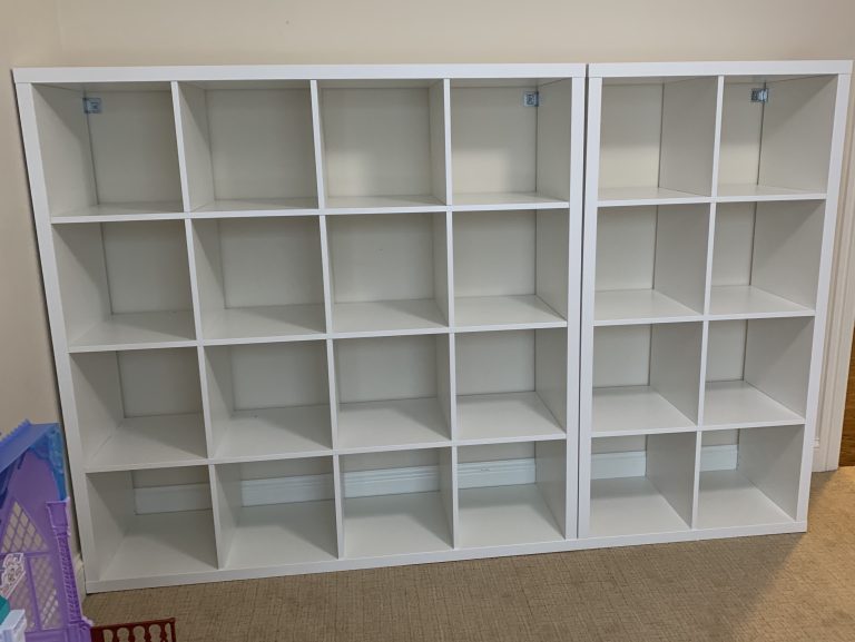 Assembly of two shelving units in playroom