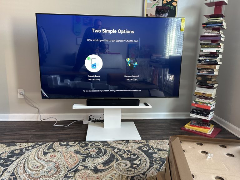 Assembly of low Japanese rolling TV stand and mounting of TV