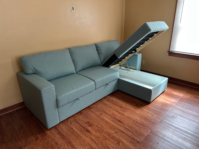 Assembly of sleeper-sofa with storage chaise