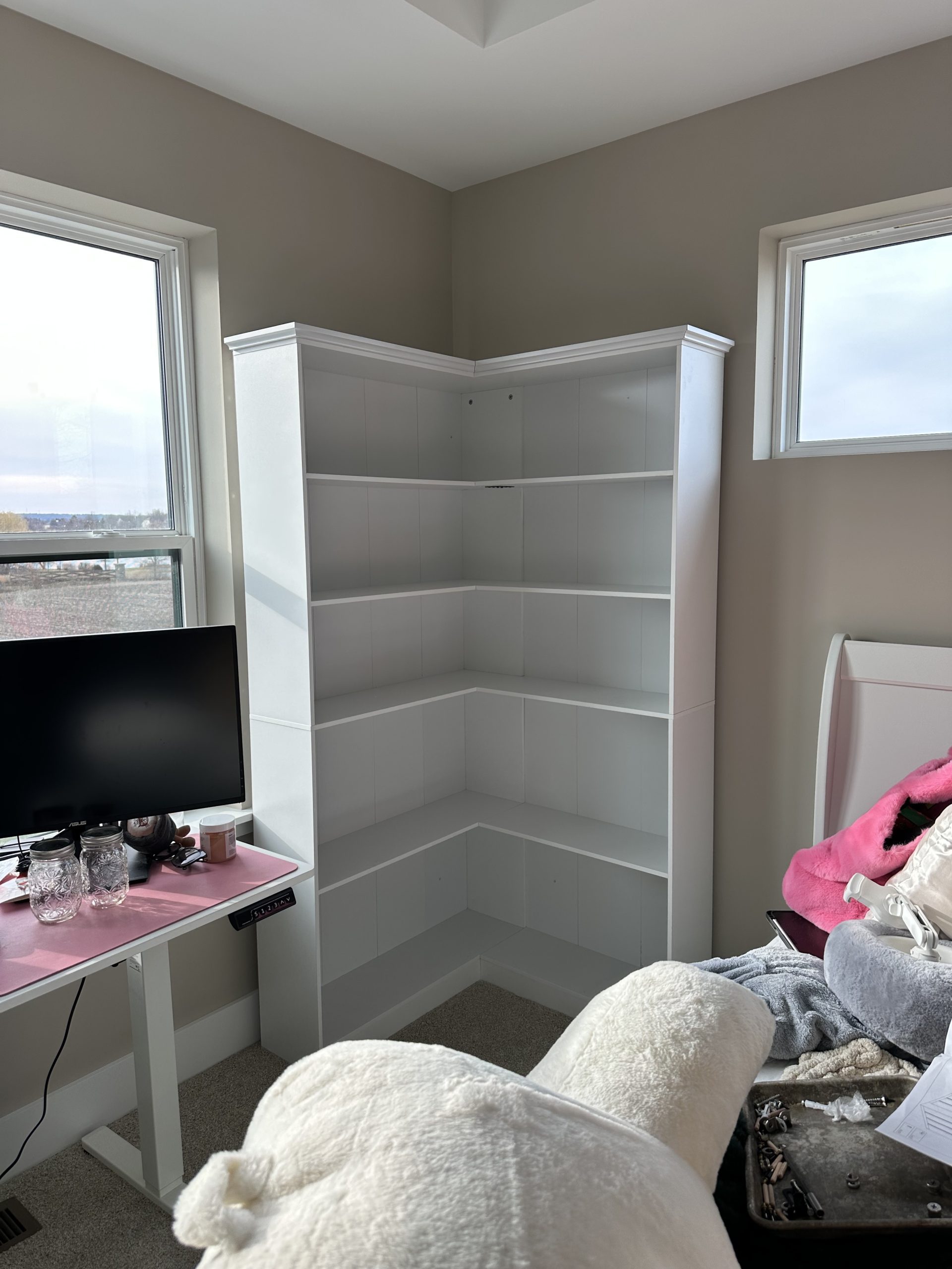 Corner bookshelf assembly by Modern Handyman in Geneva