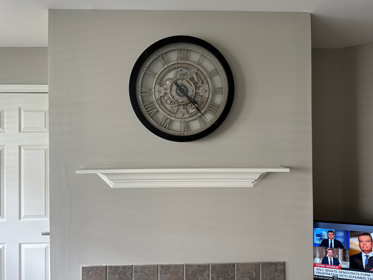 Mounting decorations throughout new apartment