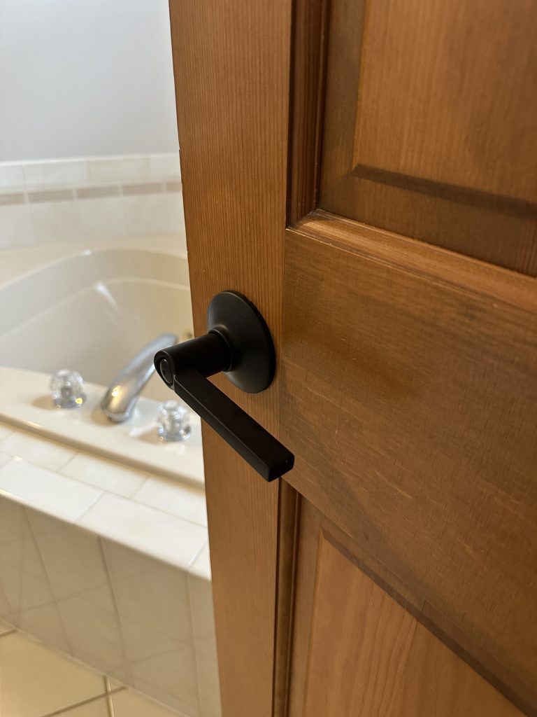 Replacing doorknobs, mounting pics and curtains